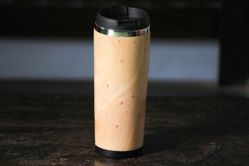 a unique drink bottle made of wood, for a fun vacation drink place.