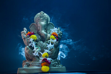lord ganesha sclupture over dark background. celebrate lord ganesha festival.