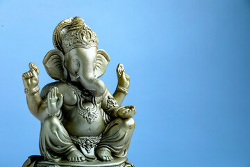 lord ganesha sclupture over blue background. celebrate lord ganesha festival.
