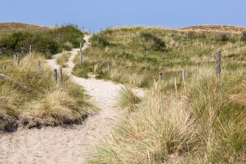 Lonely beach path over a dune on the North Sea 
