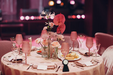 Romantic dinner pink decor table at restaurant.