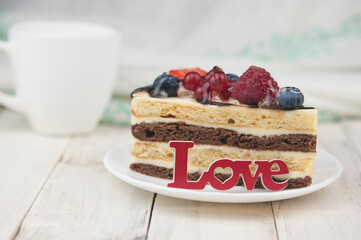 Mix berry cheese cake on white plate on wood background