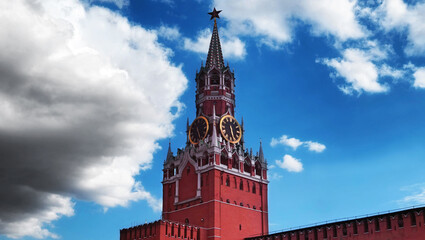 Fototapeta na wymiar Kremlin clock tower and Red Wall under blue cloudy sky