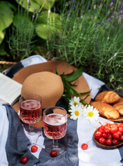 Set for picnic on blanket in lavender field