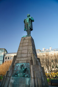 An old bronze statue under the blue sky in Reykjavik, Iceland 