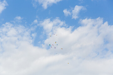 multi-colored balls in the blue sky
