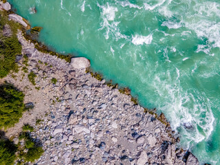 Katun river. Turquoise water and rocky coast. Altai Mountains, Russia. Aerial view