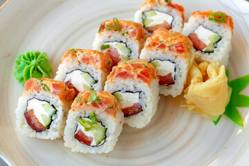 Japanese sushi roll with salmon on plate