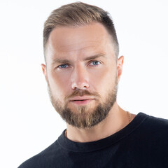 Obraz premium Close-up face of handsome man with hair style, beard, casual clothes over white background