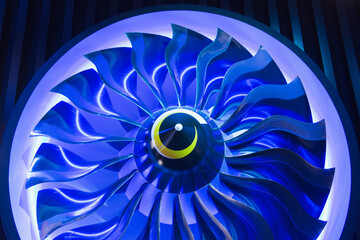 Airplane blade engine in neon blue light.