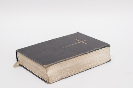 The old book the Bible with cross