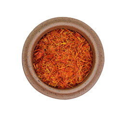 Saffron spice threads (strands) in a bowl isolated on white background. top view.