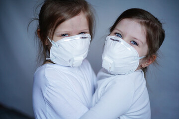 Sisters hug in hospital after vaccination, in isolation, in quarantine, wearing masks