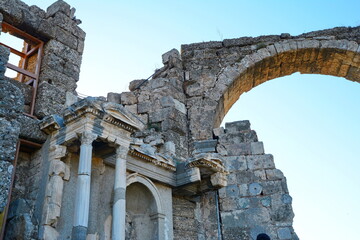 Ruins of Side in Turkey, arch of white stone. Side Ancient City, Antalya.