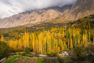 Beautiful autumn season in Hunza valley surrounded by Karakoram mountains range, Gilgit Baltistan north Pakistan