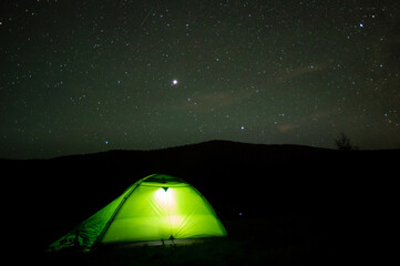 Beautiful night landscape, vacation with a tent in the mountains