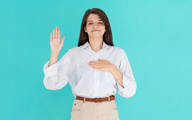 Young european woman in white shirt making a promise. I swear to tell only truth