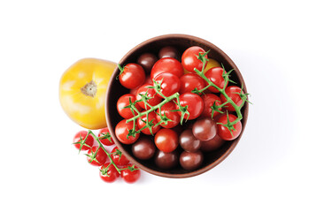 Ripe juicy cherry tomatoes in a bowl isolated on white background