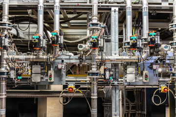 Set of valves and pipes. Factory interior. Berlin, Germany.
