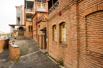 Fototapeta na wymiar The old town of Tbilisi with colorful streets and facades. Beautiful country Georgia in summer.
