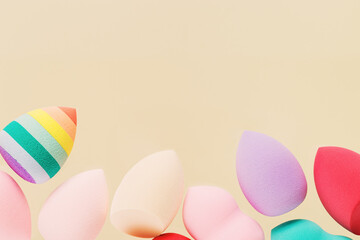 Colorful cosmetic beauty sponges different form Red, pink, rainbow colored makeup tools