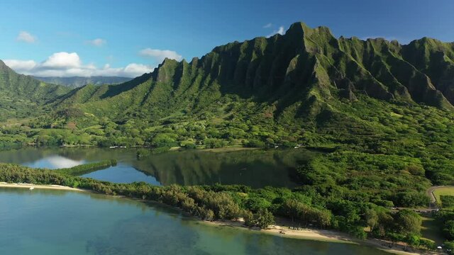 Aerial view of the ancient Moli'i fishponds with  reflections of the Koolau mountains in the ponds. The ponds are located near Kaneohe, on the island of Oahu, Hawaii, USA. 