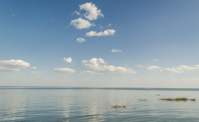 Big lake with clouds in sunny summer day, Lithuania.