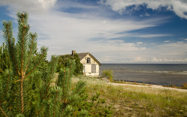 Abandoned wooden house very close to the sea.