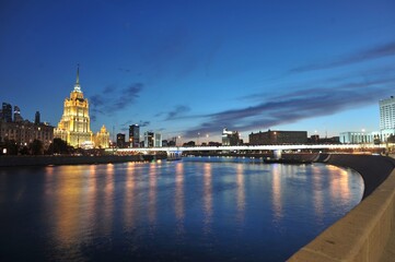 Fototapeta premium hotel Ukraine in night Moscow and the embankment of the White House, Moscow river