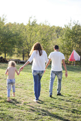 Fototapeta premium parent and child walking in park