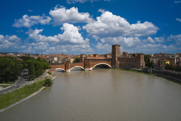 Verona, Italy aerial view of the historic city. Aerial panorama of the famous Ponte di Castelvecchio in Verona. Famous Italian Bridge aerial view. Unesco Monument Scaliger Bridge in Italy top view.