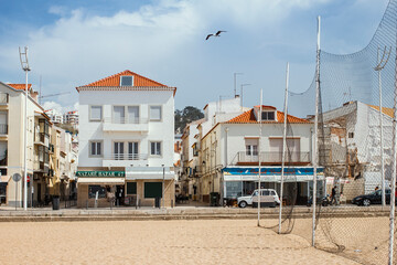 Obraz premium Nazare, Portugal - April 01, 2019: view of Nazare and beach.