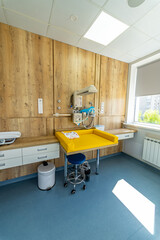 Patient modern health care ward of maternity hospital. Clinical maternity health care ward. Light colors