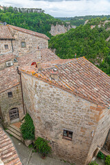 picturesque view of Sorano with old staircase, alley, underpass and plants in the Tuscan medieval village