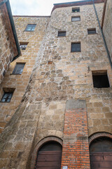 picturesque view of Sorano with old staircase, alley, underpass and plants in the Tuscan medieval village