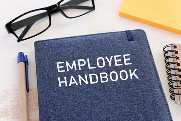Concept image of employee handbook over wooden office table. top view - obrazy, fototapety, plakaty