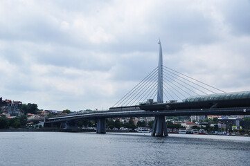 Panorama of a rainy day. Thunderclouds over the city. Bridge over the Golden Horn. July 09, 2021, Istanbul, Turkey.