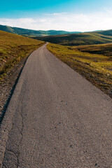 Empty winding downhill road in beautiful mountain landscape of Zlatibor, Serbia