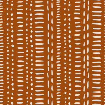 Hand-drawn abstract seamless vector pattern inspired by african mudcloth fabric. Tribal ethnic pattern with geometric elements.  