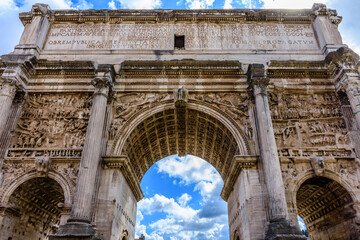 Fototapeta na wymiar An imposing, ancient Roman arch at the Forum in Rome
