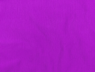 Purple jersey fabric matte texture top view. Violet knitwear satin background. Fashion color feminine clothes trend. Female blog backdrop text sign design. Lilac abstract wallpaper textile surface.