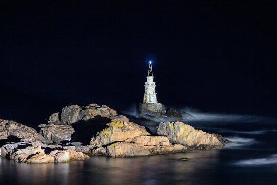 A Lighthouse on a Rock in a Dark Night on the Coast of Black Sea in Bulgaria
