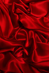 Rich and luxury red silk fabric texture background.