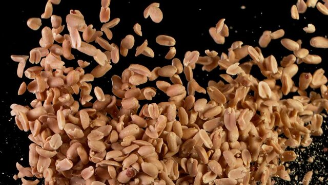Super Slow Motion Shot of Flying Roasted Peanuts. Filmed on High Speed Cinematic camera at 1000 fps.