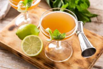 Old Cuban cocktail on wooden table.Alcoholic drink based on rum and champagne