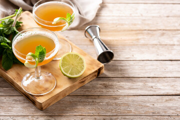 Old Cuban cocktail on wooden table. Copy space. Alcoholic drink based on rum and champagne