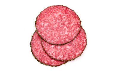 Peppered salami slices, isolated on white background.