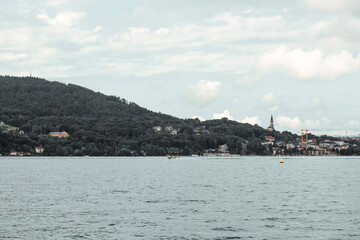 View of the mountains and lake Annecy in Haute-Savoie in France in cloudy weather in summer. Water landscape. 