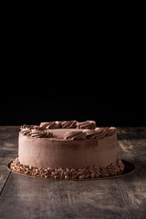 Piece of chocolate truffle cake on wooden table	