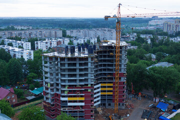 construction of a multi-storey building next to a crane